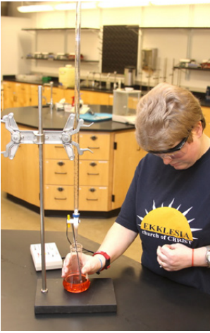 A student performing titration.