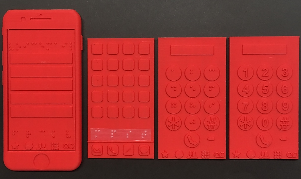 Red 3d printed models of a smartphone body with interchangeable screens that can be placed on top of the smartphone body. The screens include a home screen, a number pad with braille and a number pad with arabic numerals.