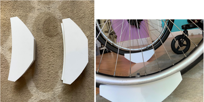 On the left, two white items with one side having flat edges and the other side rounded, in a crescent shape. On the right, the items being used to raise up a wheelchair, with the flat side on the ground, and the wheels of the wheelchair on the rounded side.
